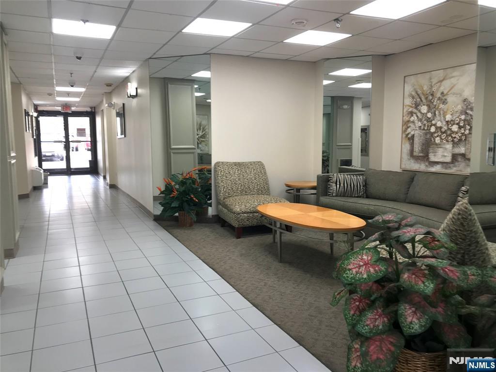 5 Linden Street, Unit 3C Hackensack, NJ 07601 - Photo 9 of 29 a living room with furniture and a rug