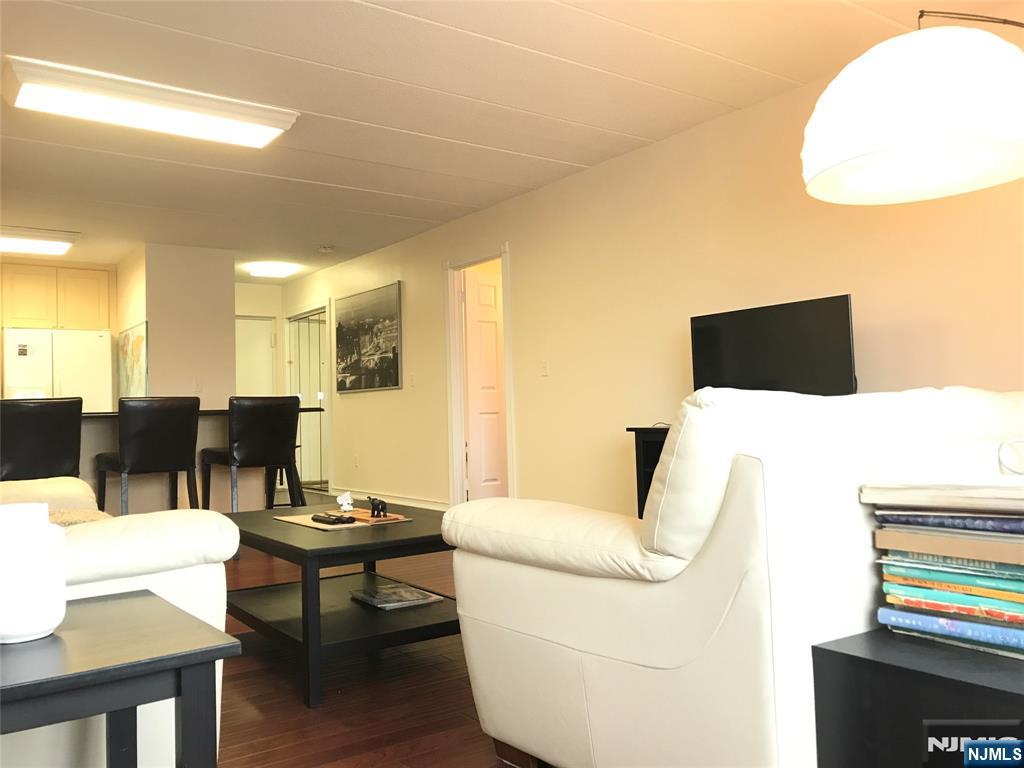 5 Linden Street, Unit 3C Hackensack, NJ 07601 - Photo 10 of 29 a living room with furniture and a flat screen tv