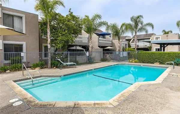 a view of a backyard with a patio and plants