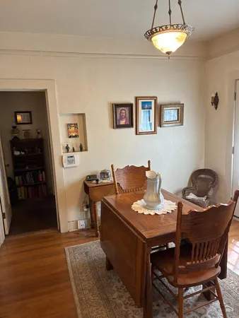 a view of a workspace with furniture and a kitchen