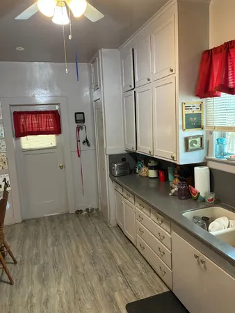 a kitchen with stainless steel appliances granite countertop a sink a stove and a refrigerator