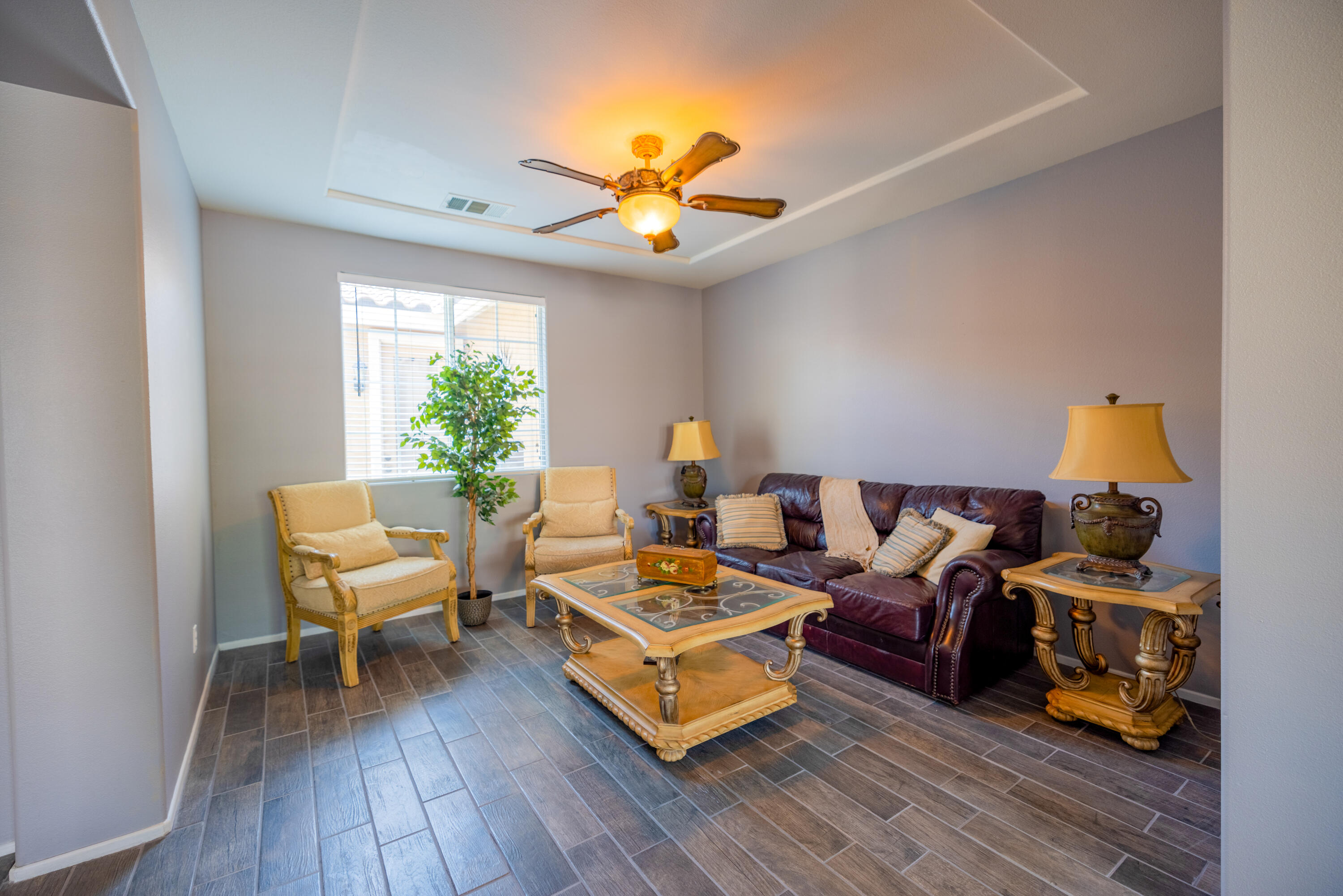 83332 Lone Star Road Indio, CA 92203 - Photo 11 of 33 a living room with furniture a chandelier and a rug