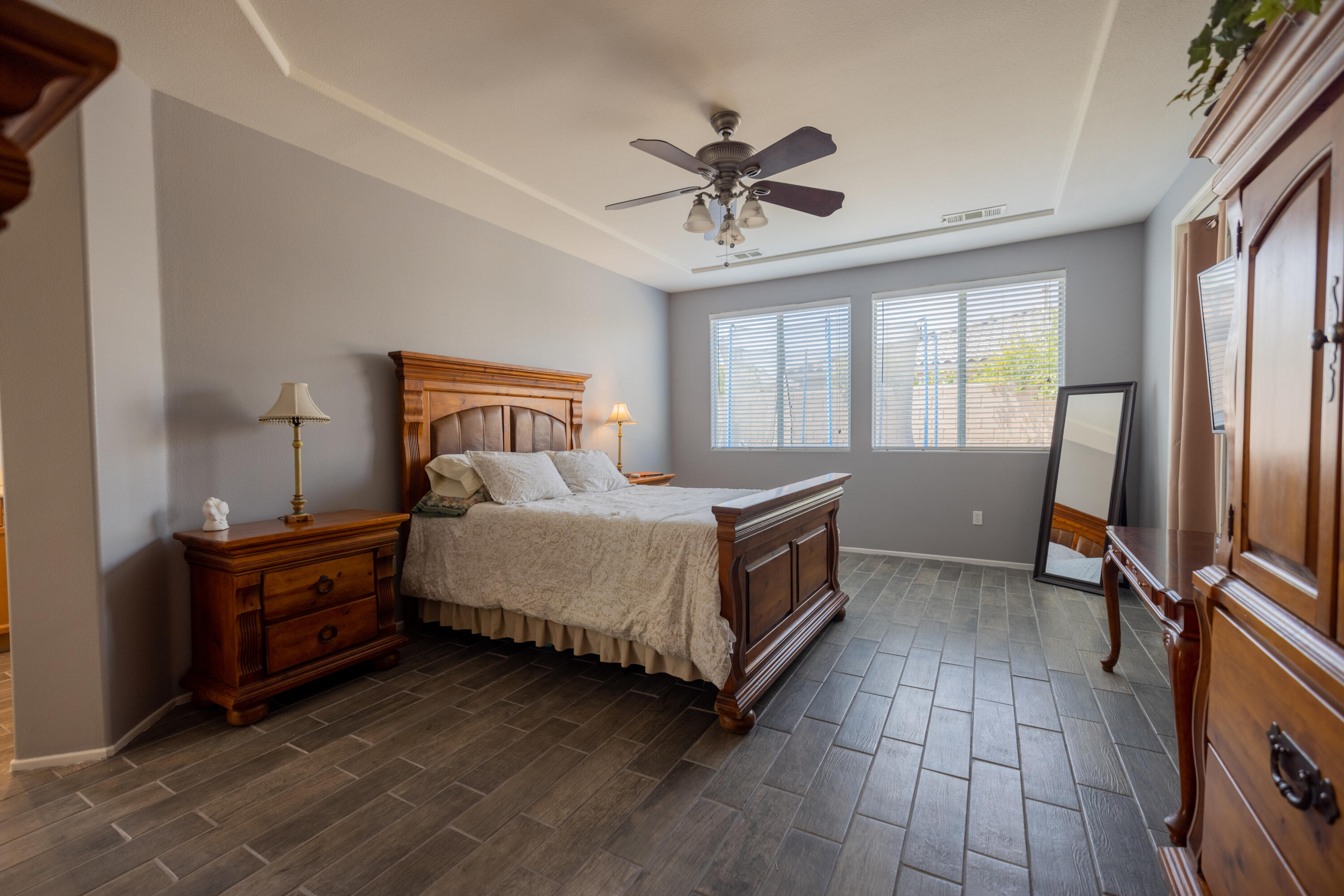 83332 Lone Star Road Indio, CA 92203 - Photo 14 of 33 a spacious bedroom with a bed and a chandelier