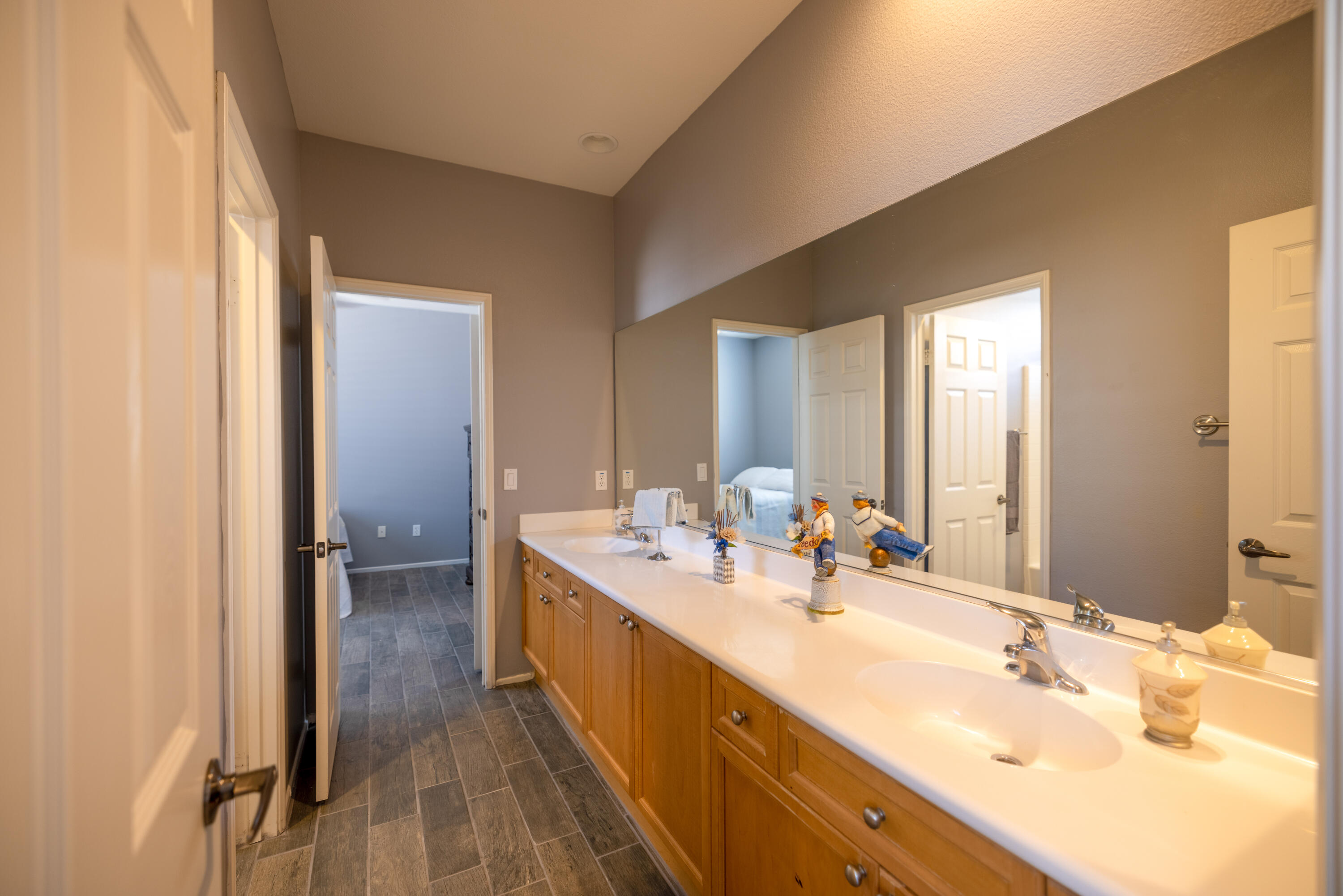 83332 Lone Star Road Indio, CA 92203 - Photo 20 of 33 a spacious bathroom with a double vanity sink and a mirror