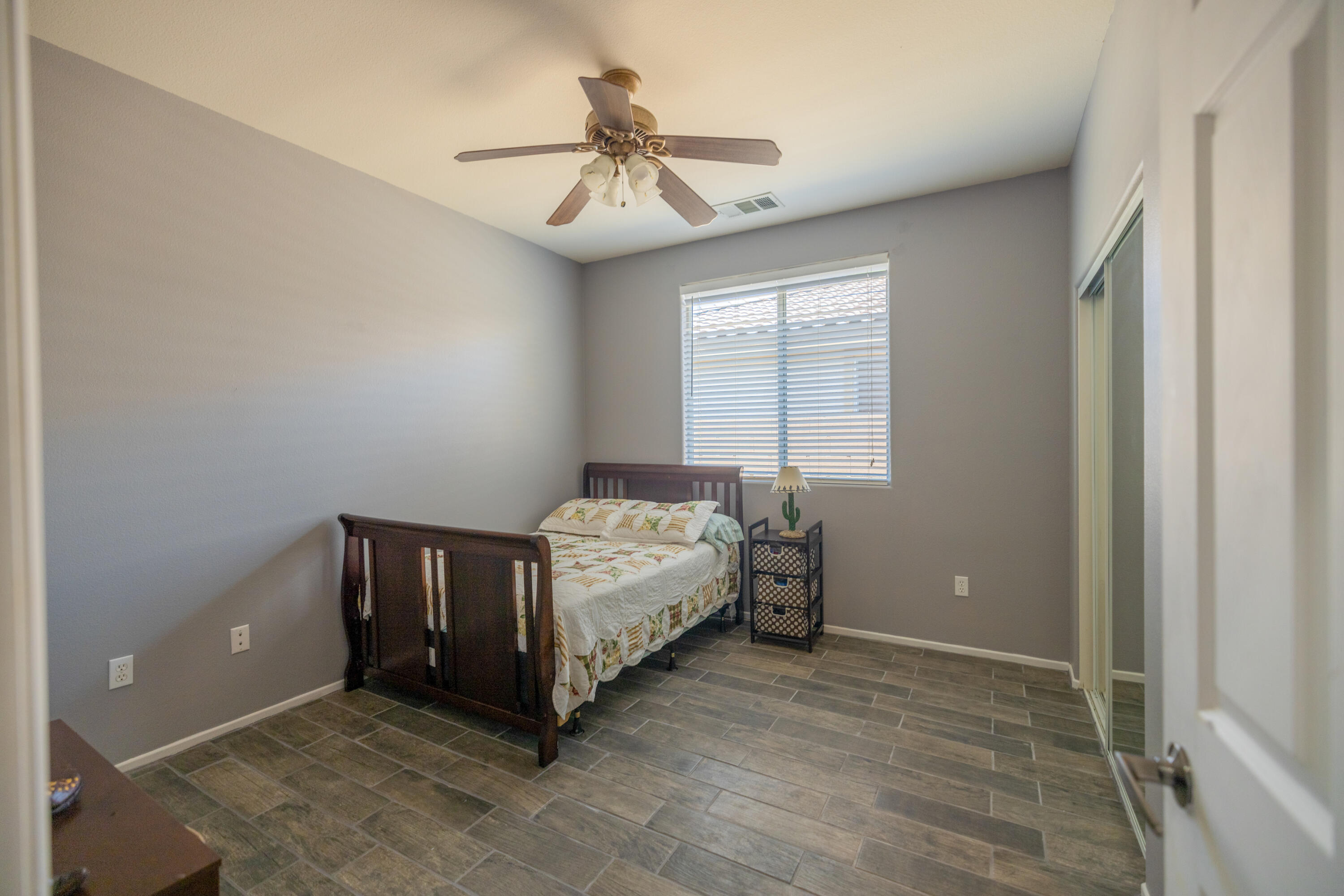 83332 Lone Star Road Indio, CA 92203 - Photo 23 of 33 a bedroom with a bed and a ceiling fan