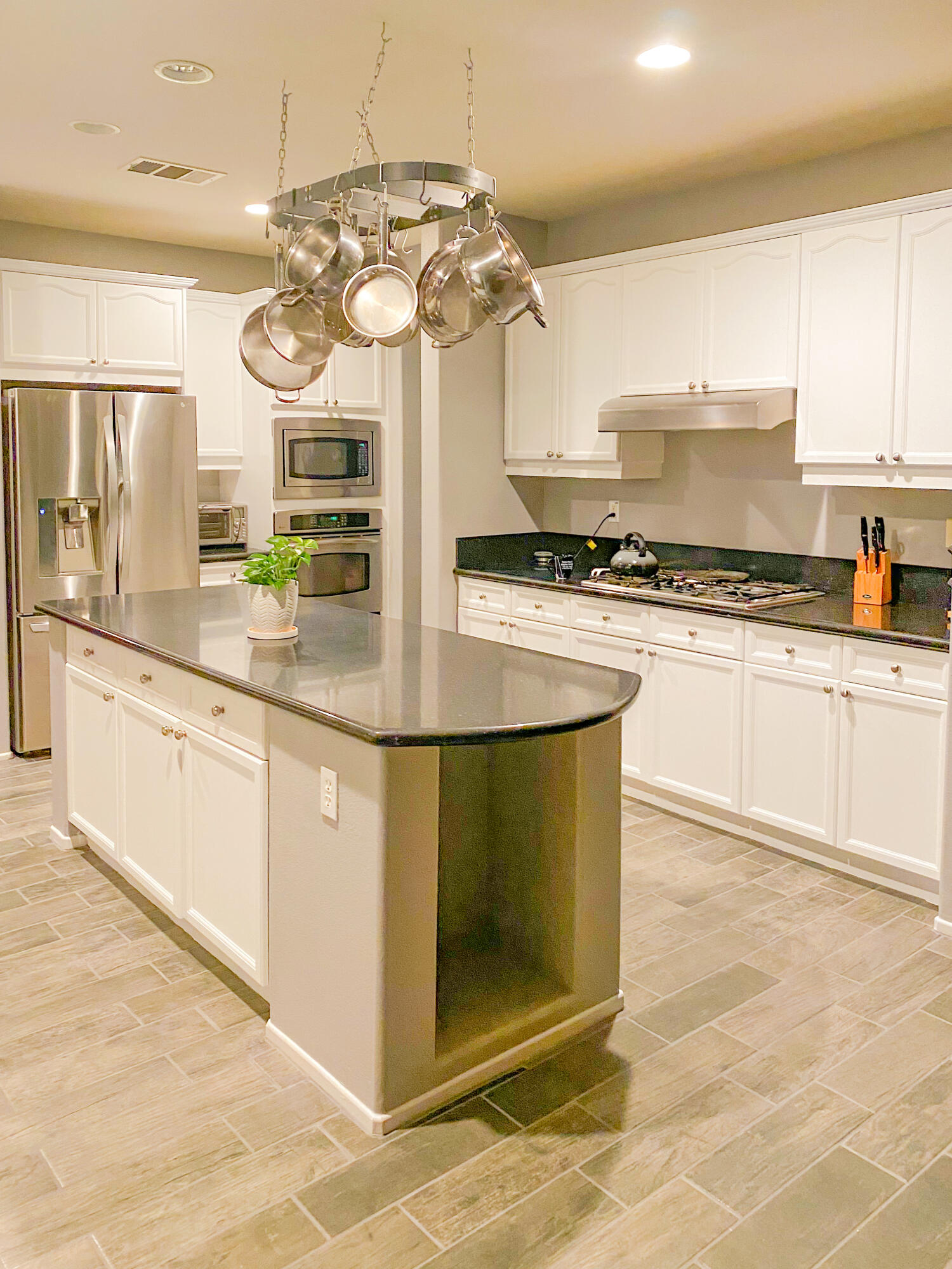 83332 Lone Star Road Indio, CA 92203 - Photo 8 of 33 a kitchen with stainless steel appliances granite countertop a stove a sink and a refrigerator