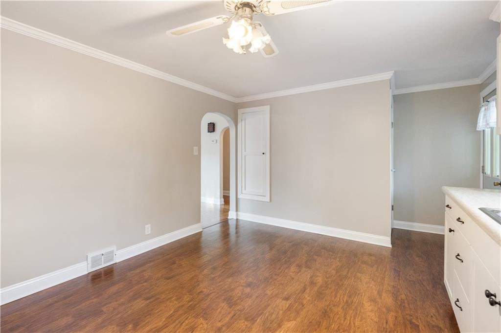 355 Highway 31 Ruffs Dale, PA 15679 - Photo 11 of 25 an empty room with wooden floor and windows