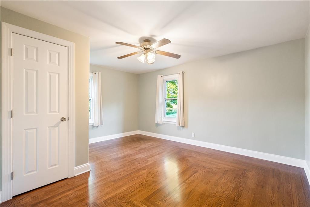 355 Highway 31 Ruffs Dale, PA 15679 - Photo 16 of 25 a view of an empty room with window and wooden floor