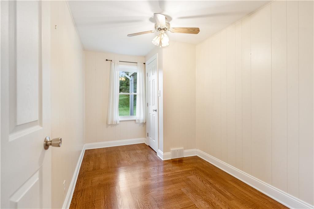 355 Highway 31 Ruffs Dale, PA 15679 - Photo 17 of 25 wooden floor in an empty room