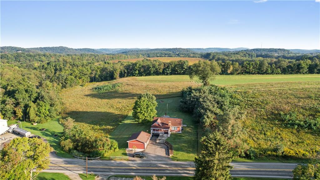 355 Highway 31 Ruffs Dale, PA 15679 - Photo 4 of 25 an aerial view of residential houses with outdoor space and trees