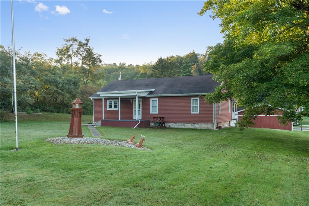 355 Highway 31 Ruffs Dale, PA 15679 - Photo 7 of 25 a front view of a house with garden