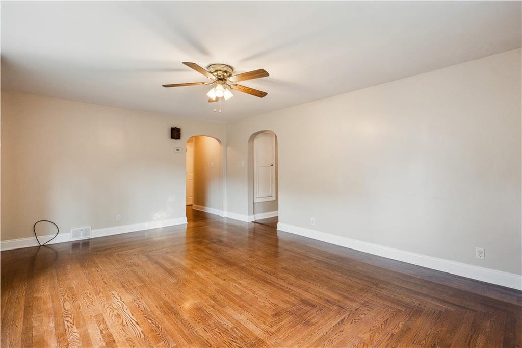 355 Highway 31 Ruffs Dale, PA 15679 - Photo 9 of 25 a view of an empty room with window and wooden floor