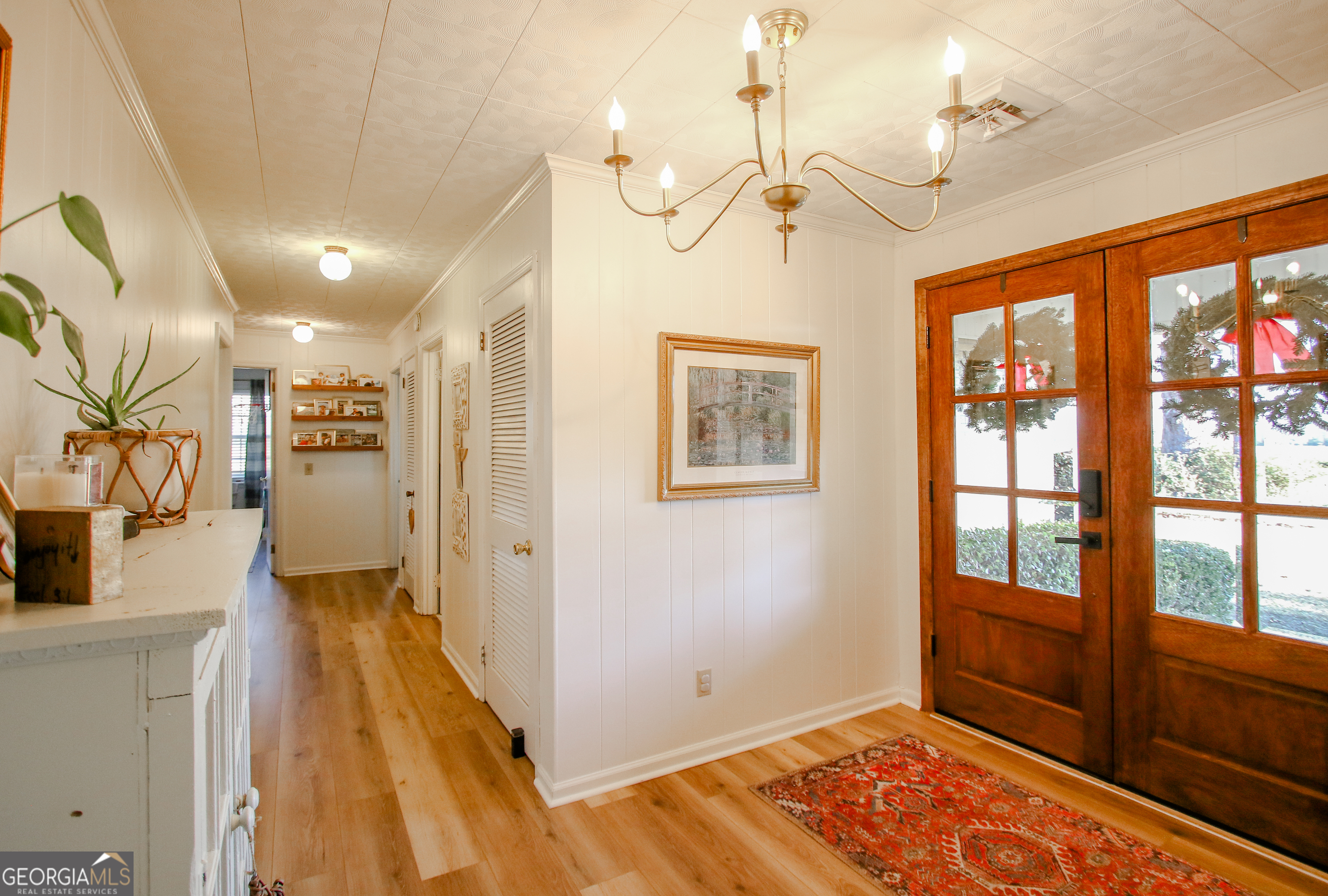 813 Evergreen Road Cobbtown, GA 30420 - Photo 11 of 72 a view of a bedroom with wooden floor and windows