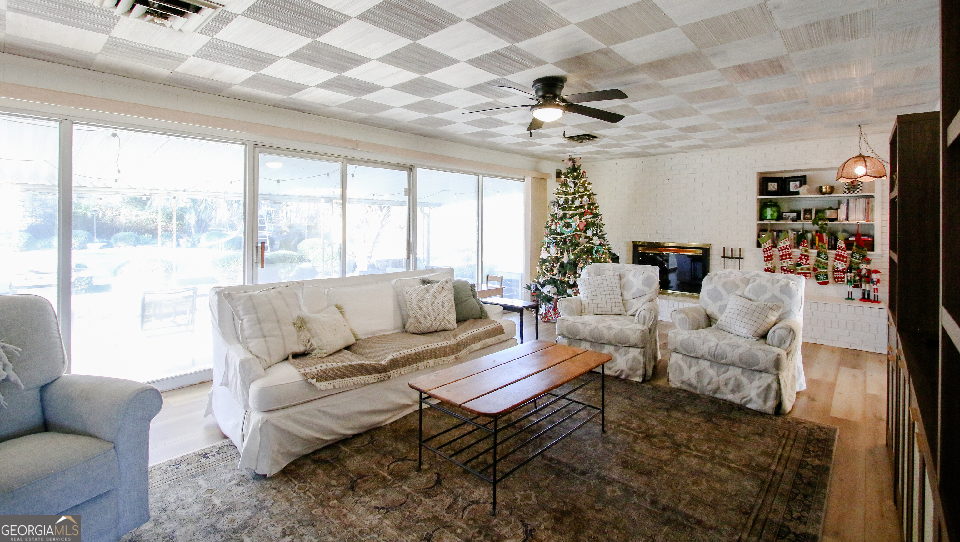 813 Evergreen Road Cobbtown, GA 30420 - Photo 15 of 72 a living room with furniture a ceiling fan and a large window