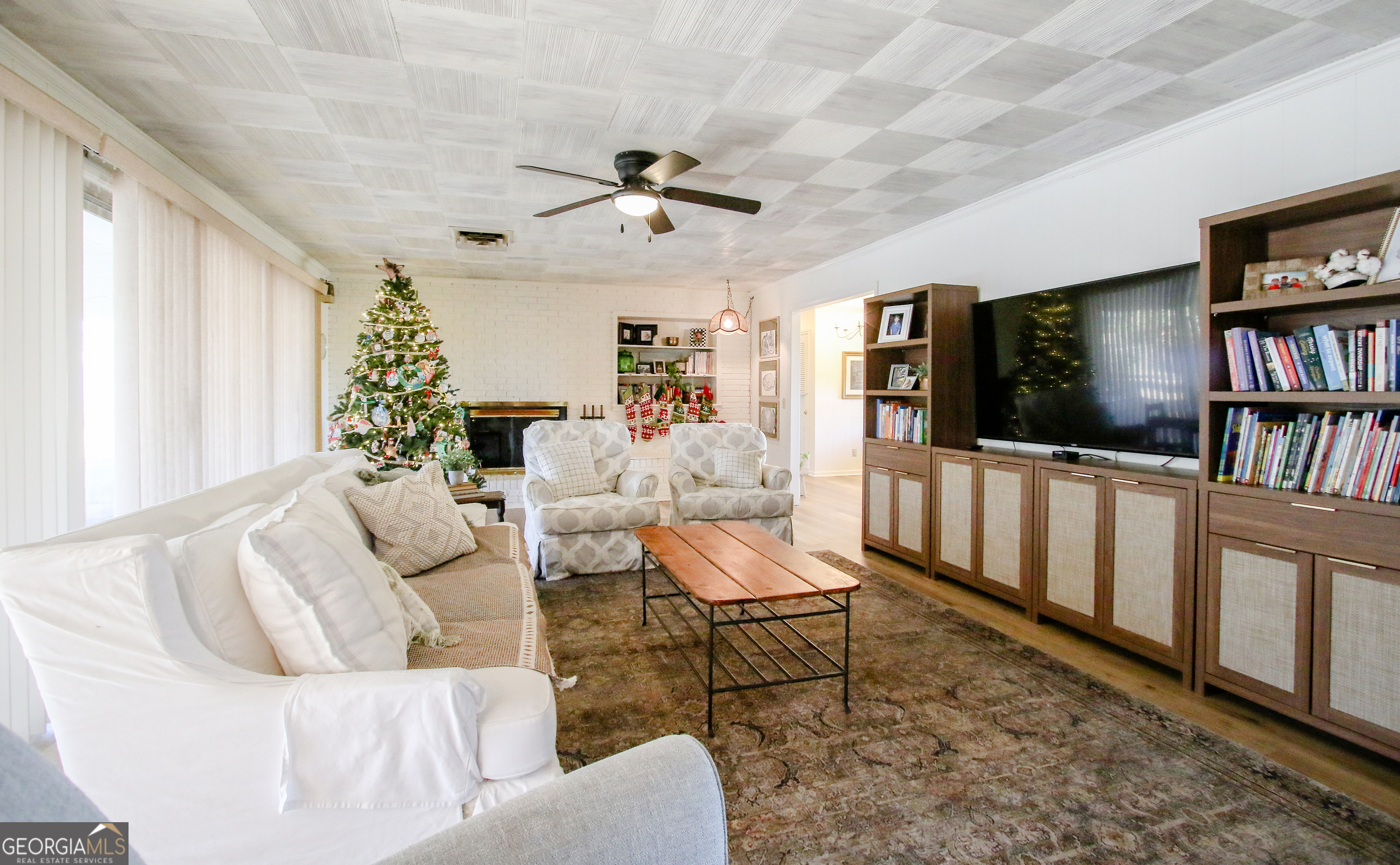 813 Evergreen Road Cobbtown, GA 30420 - Photo 19 of 72 a living room with furniture and a flat screen tv