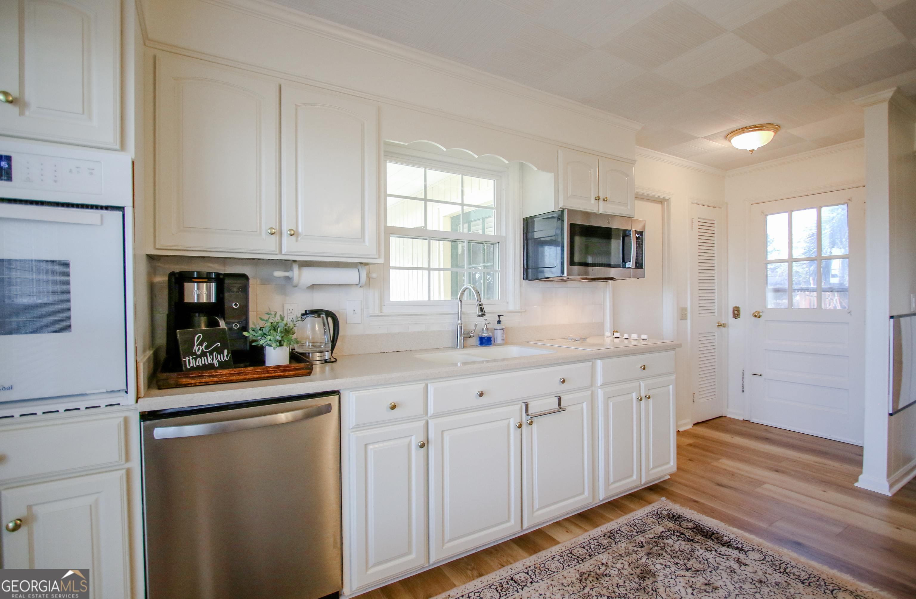 813 Evergreen Road Cobbtown, GA 30420 - Photo 25 of 72 a kitchen with sink cabinets and appliances