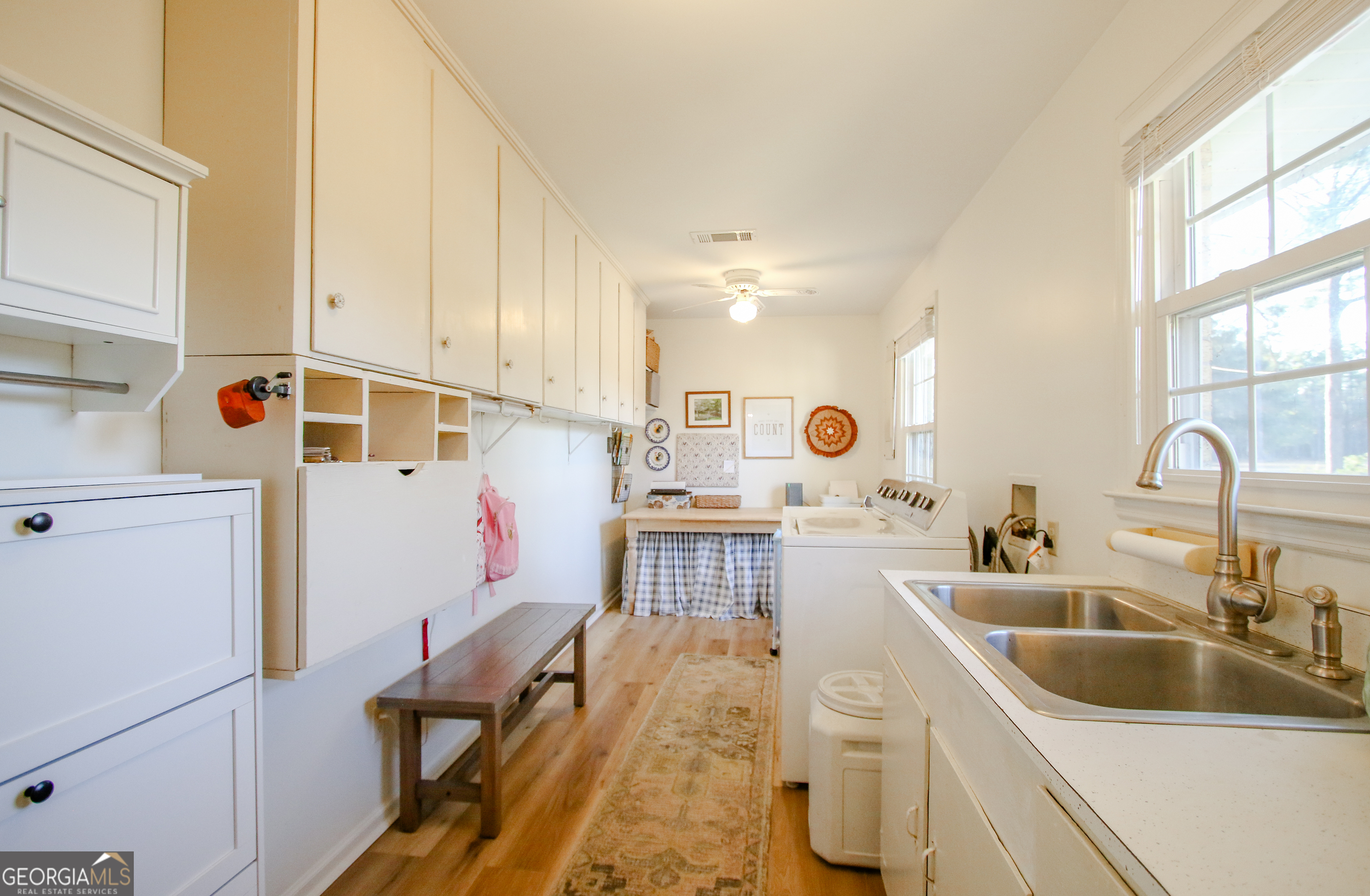 813 Evergreen Road Cobbtown, GA 30420 - Photo 29 of 72 a kitchen with a sink cabinets and a refrigerator