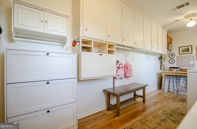 a bedroom with a bed and windows