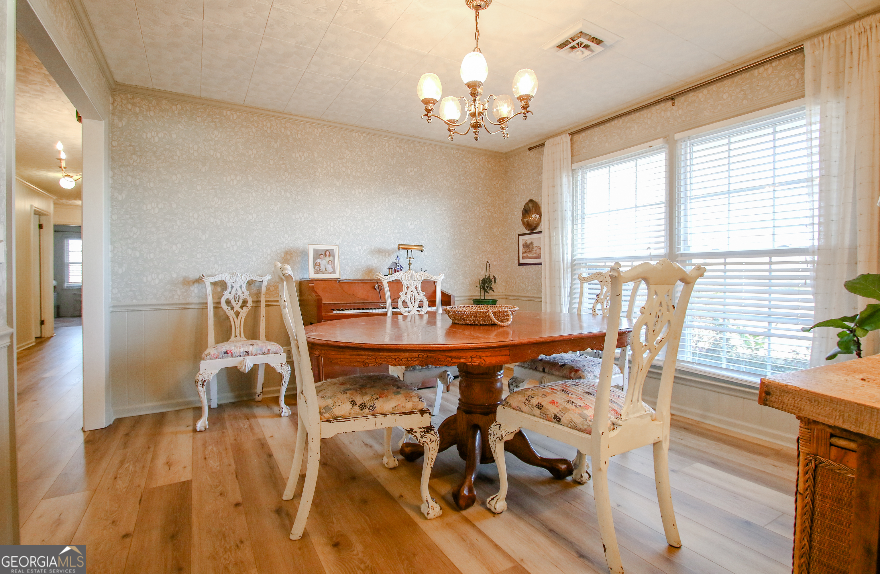 813 Evergreen Road Cobbtown, GA 30420 - Photo 33 of 72 a view of a dining room with furniture window and wooden floor