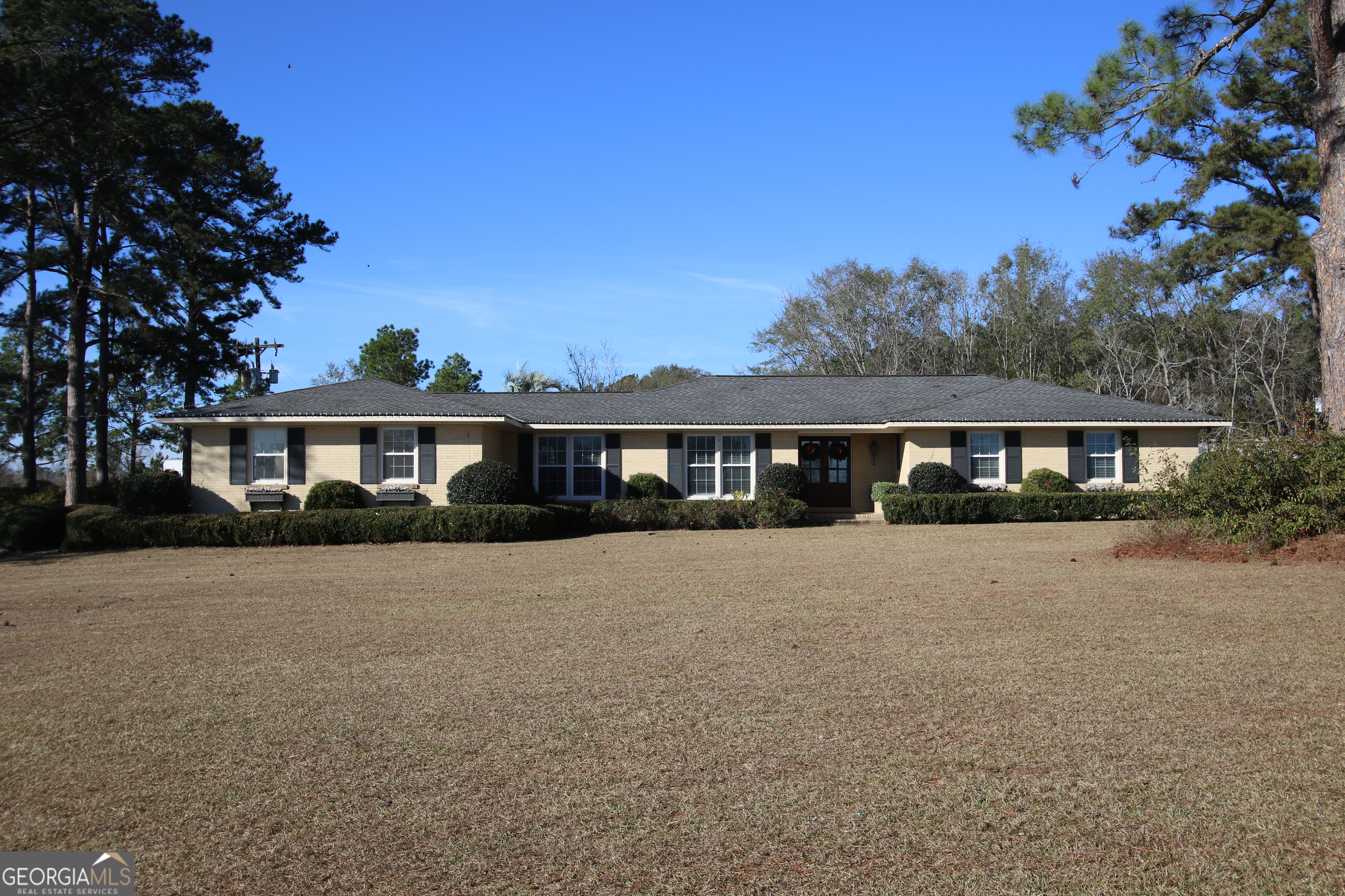 813 Evergreen Road Cobbtown, GA 30420 - Photo 4 of 72 a front view of a house with a yard