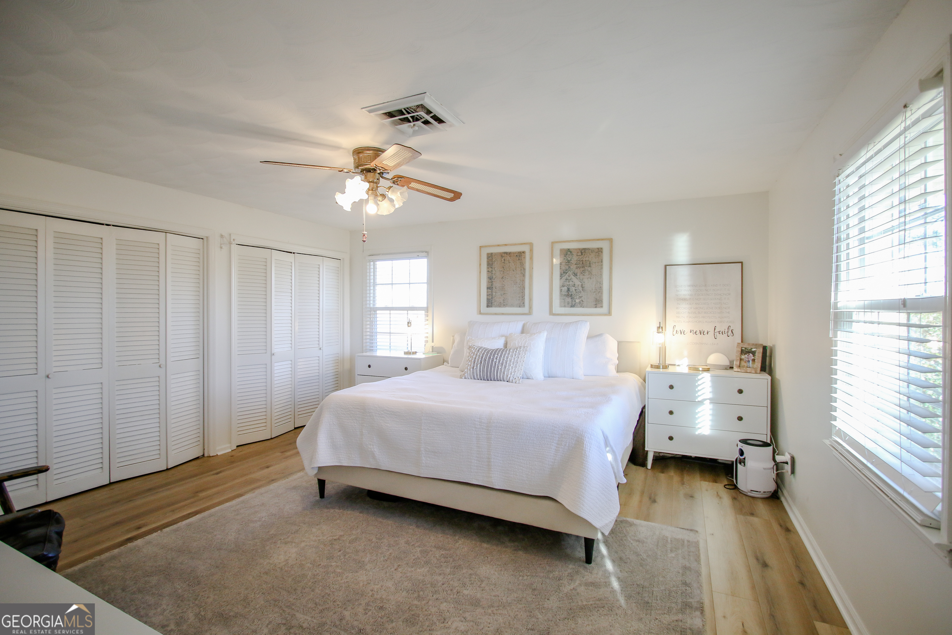 813 Evergreen Road Cobbtown, GA 30420 - Photo 47 of 72 a bedroom with a bed and a chandelier