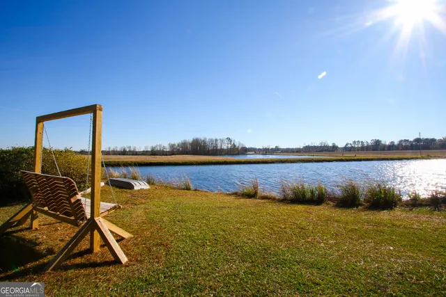 a view of a lake with a tree