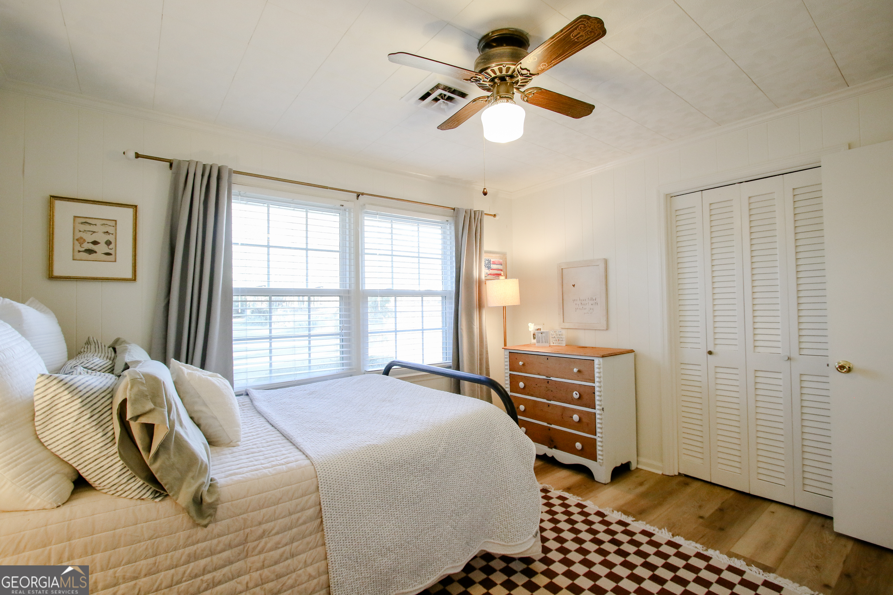 813 Evergreen Road Cobbtown, GA 30420 - Photo 51 of 72 a bedroom with a bed and a window