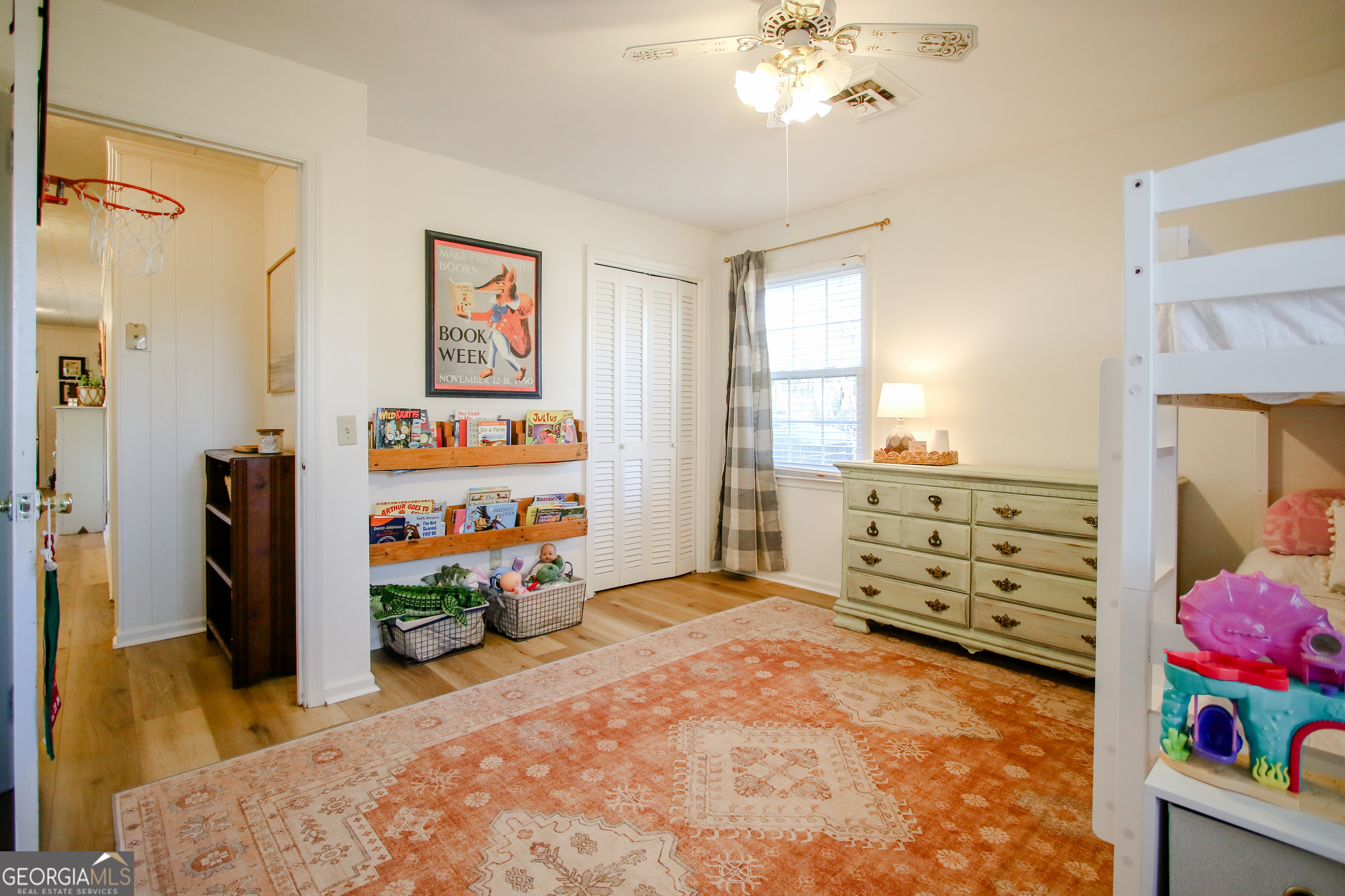 813 Evergreen Road Cobbtown, GA 30420 - Photo 54 of 72 a bed room with a bed mirror and a window