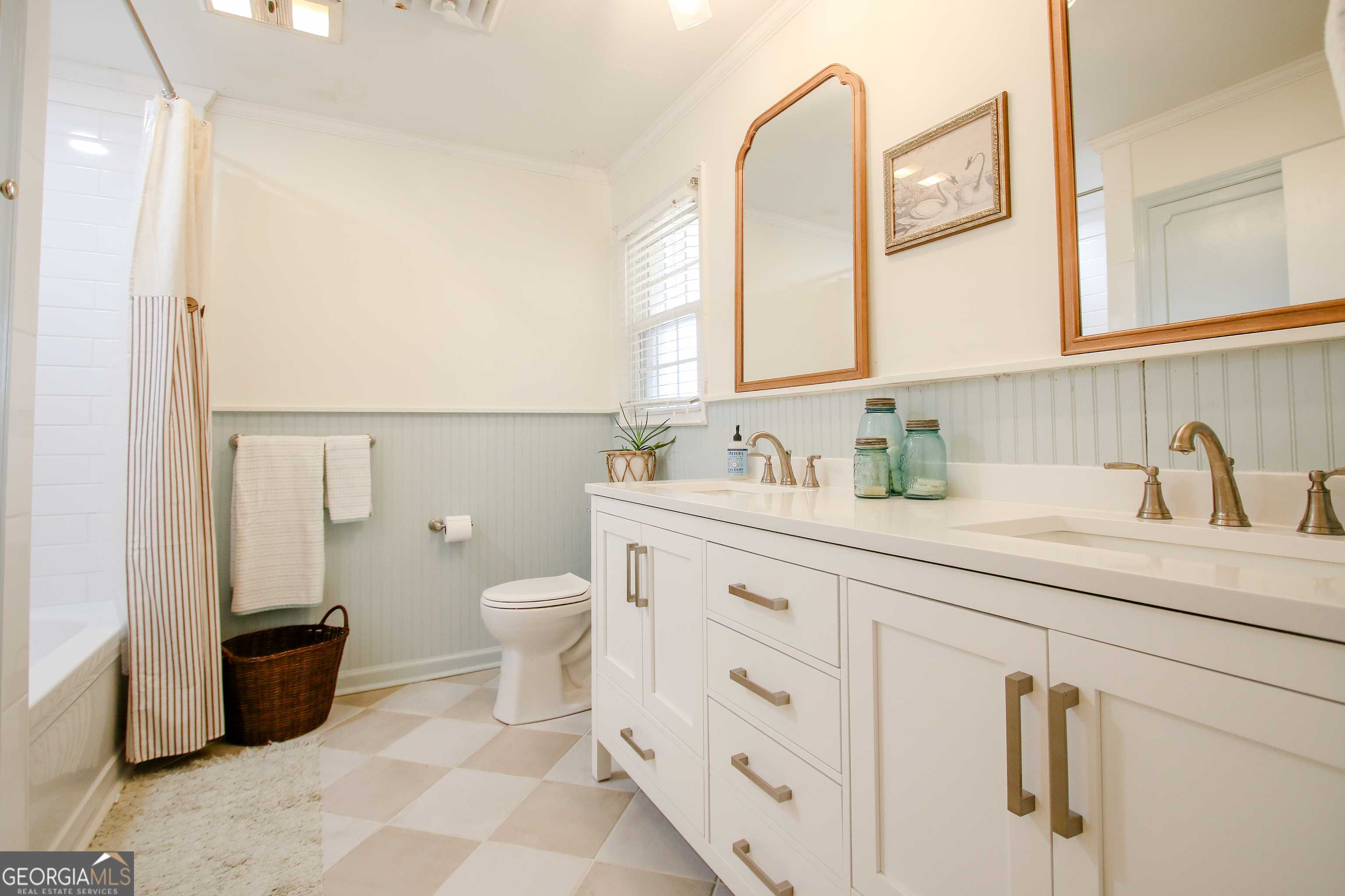 813 Evergreen Road Cobbtown, GA 30420 - Photo 58 of 72 a bathroom with a sink a toilet and mirror