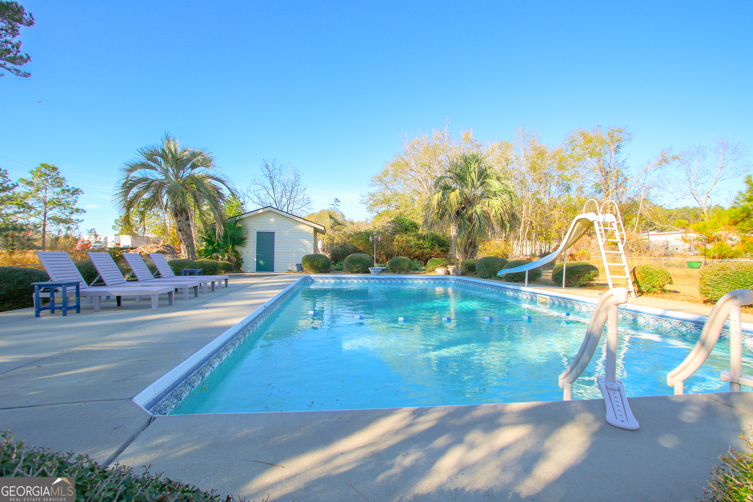 813 Evergreen Road Cobbtown, GA 30420 - Photo 61 of 72 a view of a swimming pool with a patio