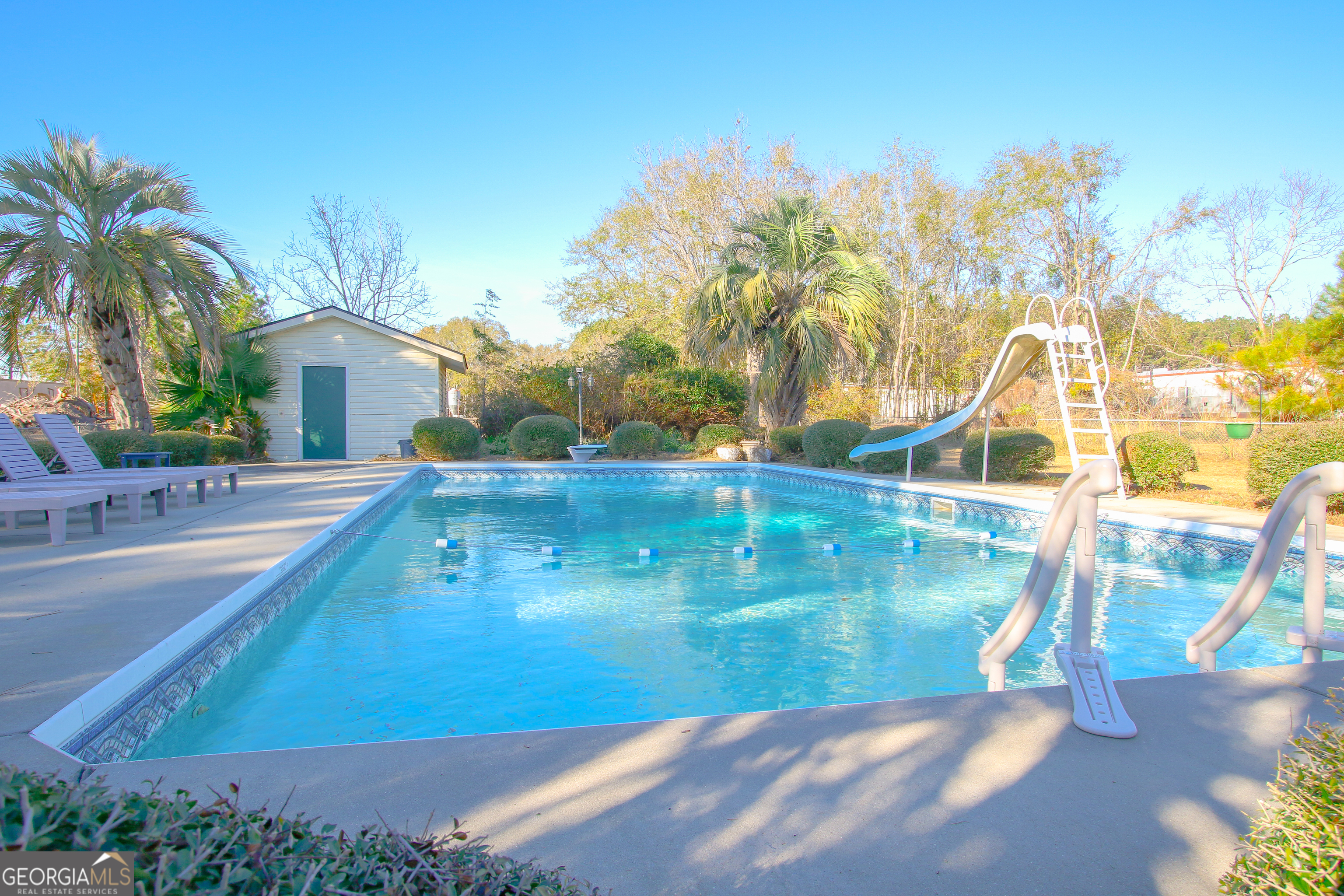 813 Evergreen Road Cobbtown, GA 30420 - Photo 62 of 72 a view of a swimming pool with an outdoor space
