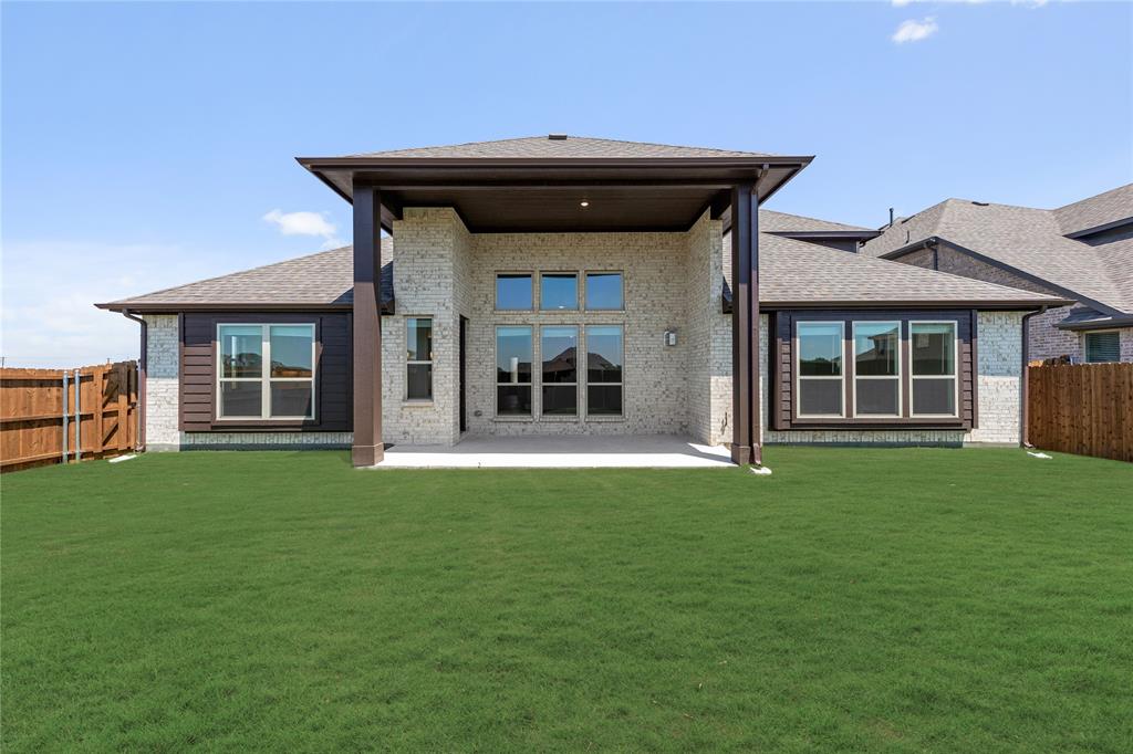 1145 Hitching Post Way Oak Point, TX 75068 - Photo 38 of 39 a view of a house with backyard and porch