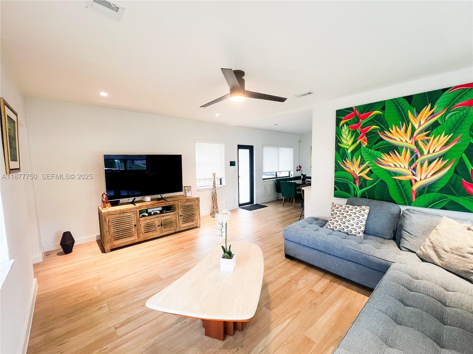 1600 Southwest 17th Avenue Miami, FL 33145 - Photo 14 of 32 a living room with furniture and a flat screen tv