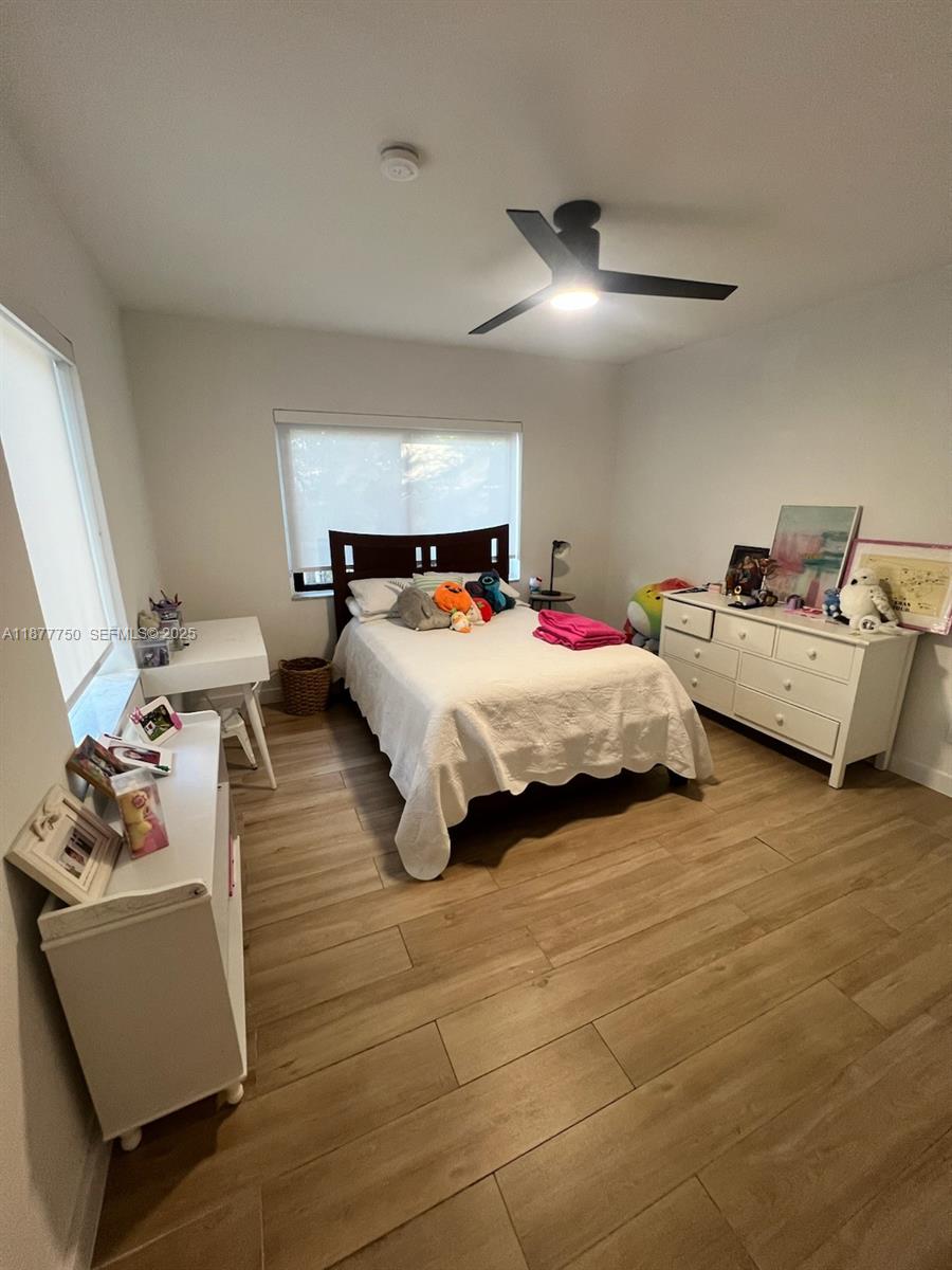 1600 Southwest 17th Avenue Miami, FL 33145 - Photo 16 of 32 a bedroom with a bed and window