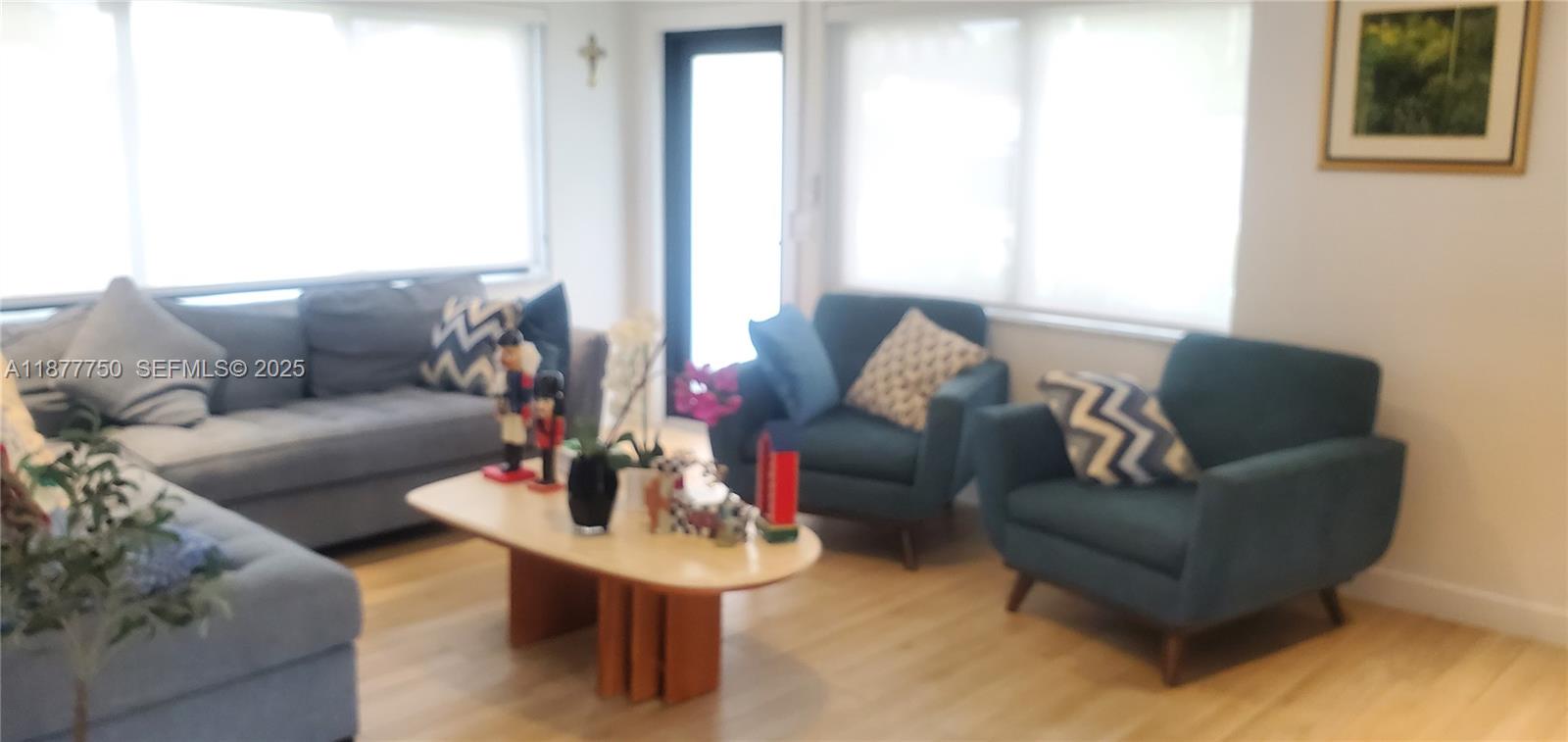 1600 Southwest 17th Avenue Miami, FL 33145 - Photo 27 of 32 a living room with furniture and a potted plant