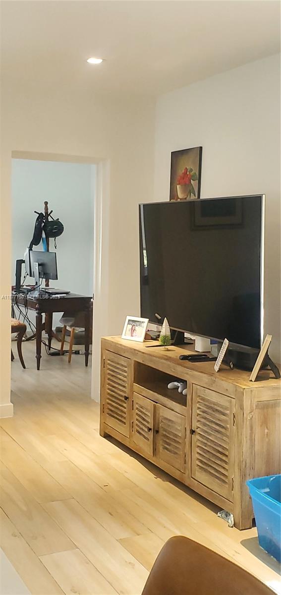 1600 Southwest 17th Avenue Miami, FL 33145 - Photo 30 of 32 a living room with furniture and a flat screen tv