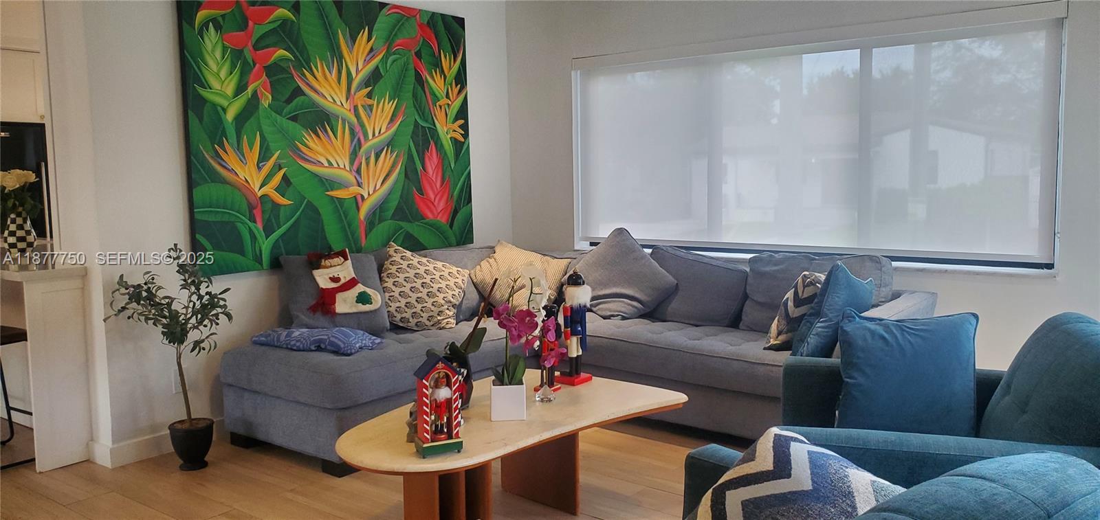 1600 Southwest 17th Avenue Miami, FL 33145 - Photo 31 of 32 a living room with furniture and a potted plant