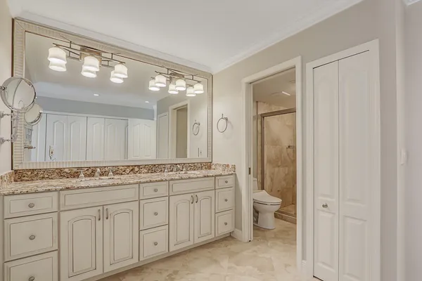 a bathroom with a shower and toilet