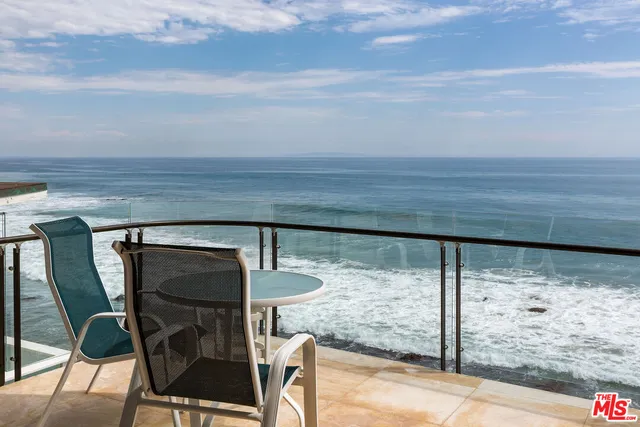 a view of balcony with furniture