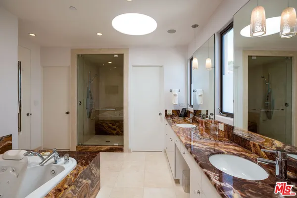 a view of a bathroom sink and mirror
