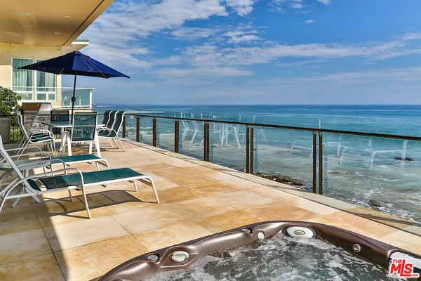 a view of swimming pool with a patio