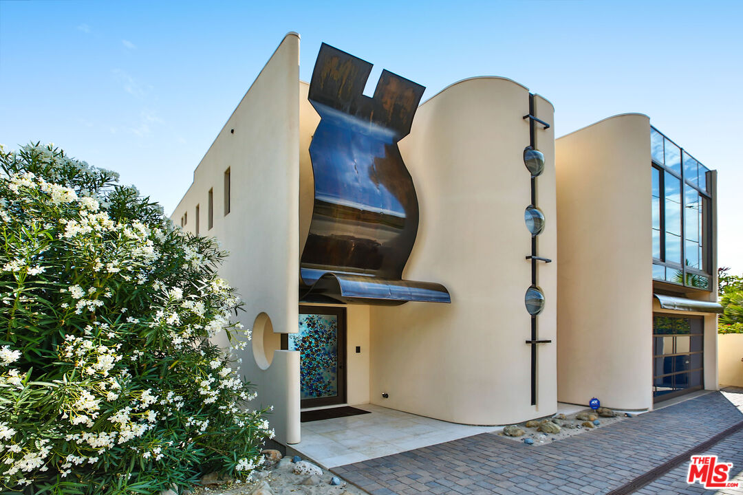 24230 Malibu Road Malibu, CA 90265 - Photo 4 of 27 a front view of a house with entryway