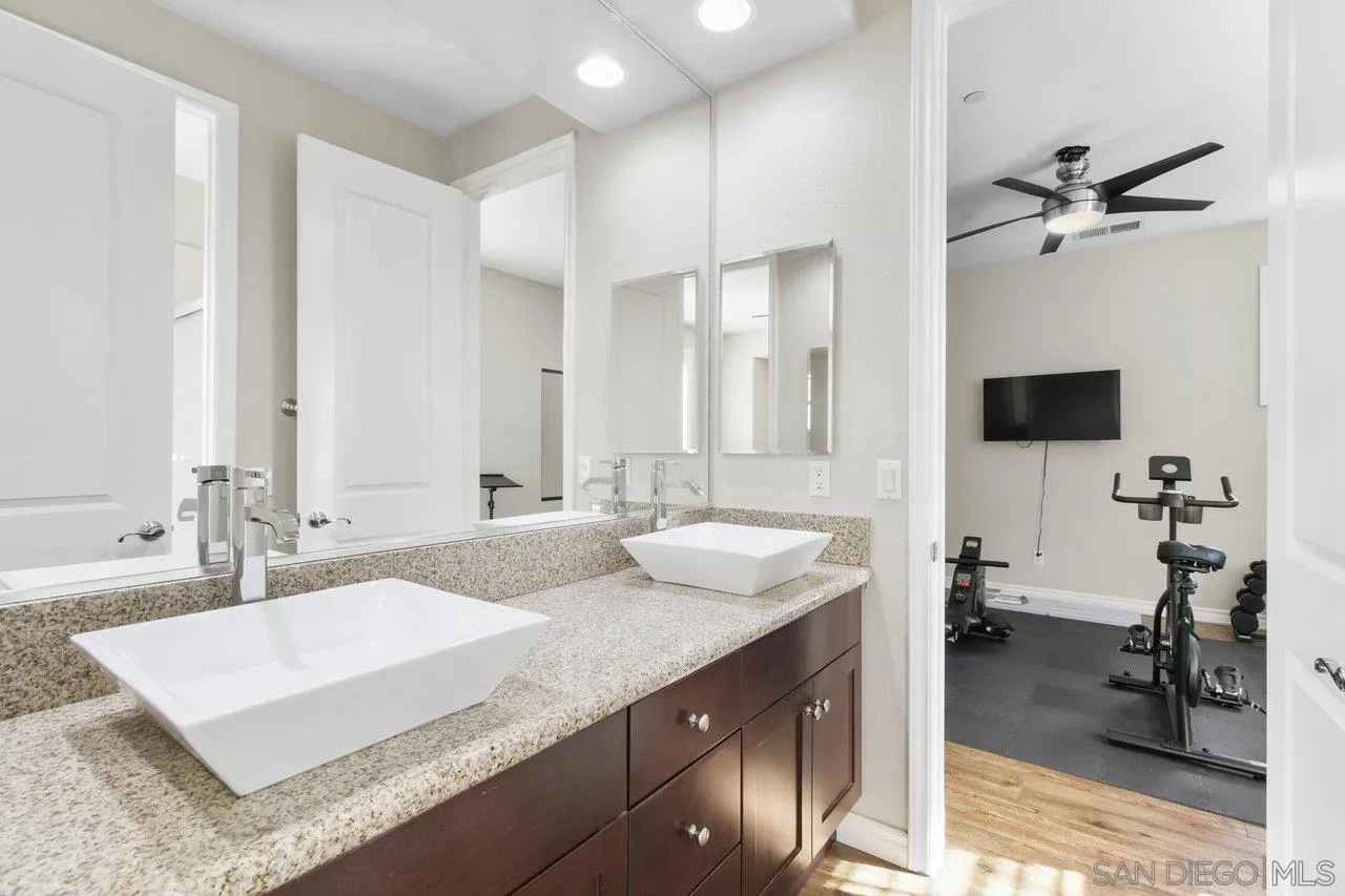 2957 Ranch Gate Road Chula Vista, CA 91914 - Photo 32 of 75 a bathroom with a sink double vanity and a shower