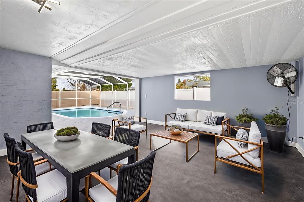 11214 Kapok Avenue Port Richey, FL 34668 - Photo 23 of 25 a view of a dining room with furniture window and outside view