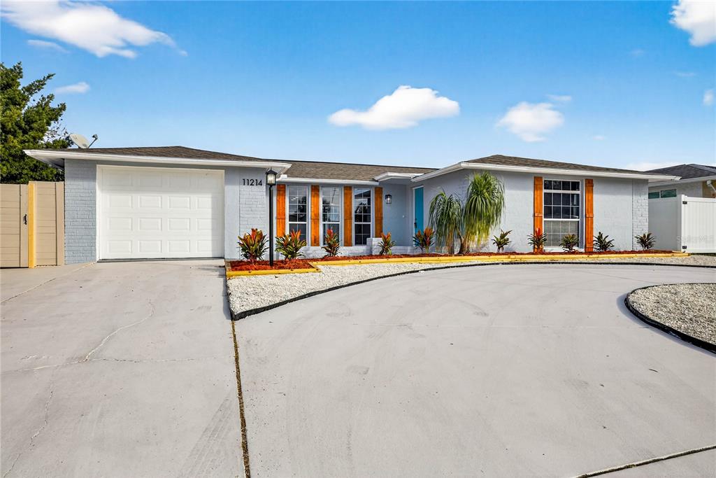 11214 Kapok Avenue Port Richey, FL 34668 - Photo 3 of 25 a view of a swimming pool with outdoor seating