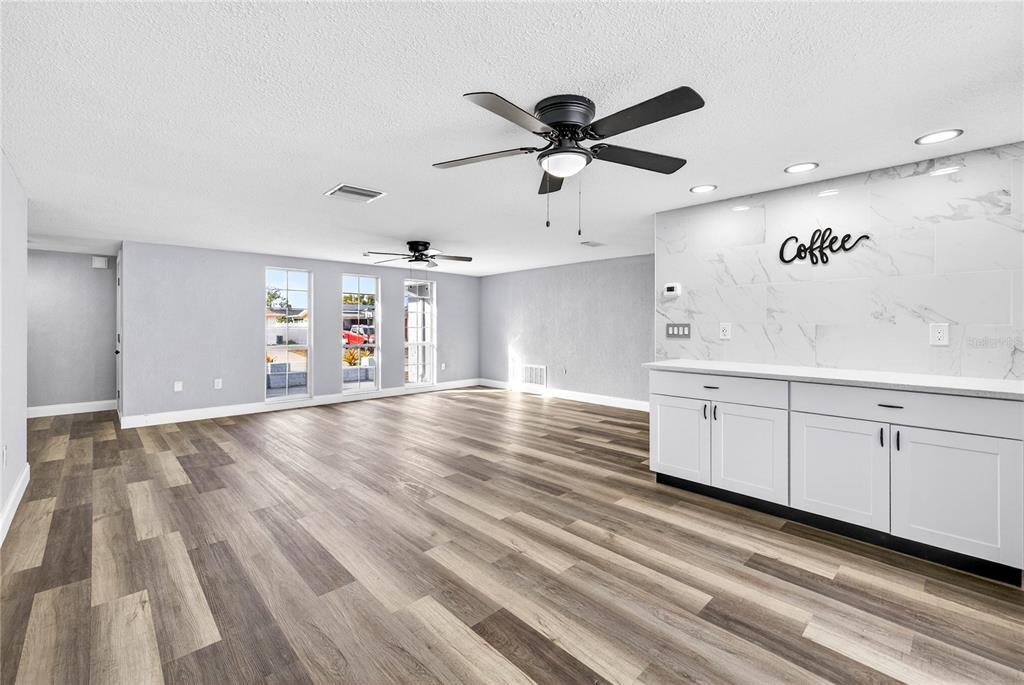 11214 Kapok Avenue Port Richey, FL 34668 - Photo 9 of 25 a view of a livingroom with wooden floor