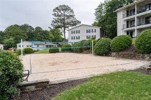 1150 Collier Road Northwest, Unit 6H Atlanta, GA 30318 - Photo 23 of 29 a view of multiple houses with a yard