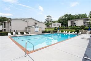 1150 Collier Road Northwest, Unit 6H Atlanta, GA 30318 - Photo 24 of 29 a view of a house with a backyard