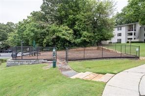 1150 Collier Road Northwest, Unit 6H Atlanta, GA 30318 - Photo 25 of 29 a view of a backyard with a small cabin