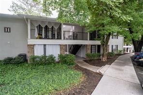 1150 Collier Road Northwest, Unit 6H Atlanta, GA 30318 - Photo 29 of 29 a front view of a house with garden